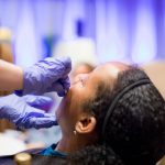 African American Woman Derm Procedure
